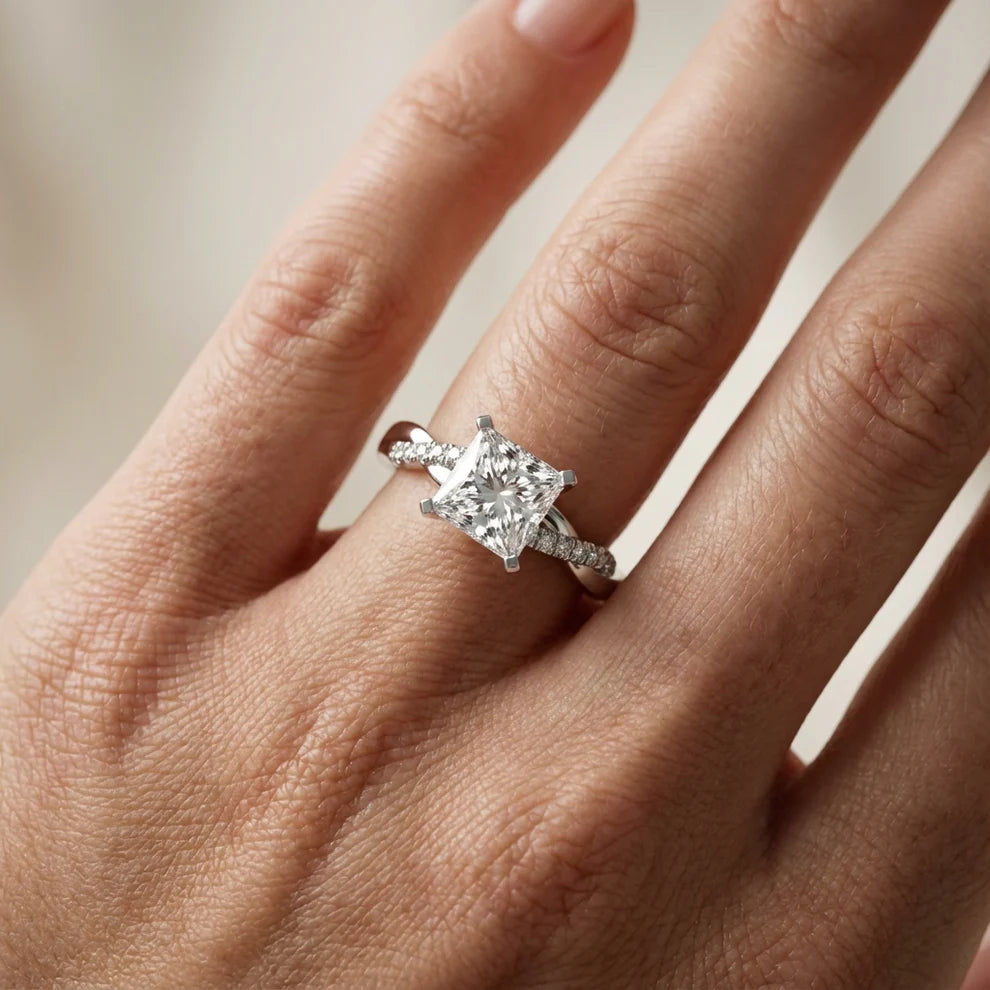 Twisted Side Stone Round Diamond Engagement Ring