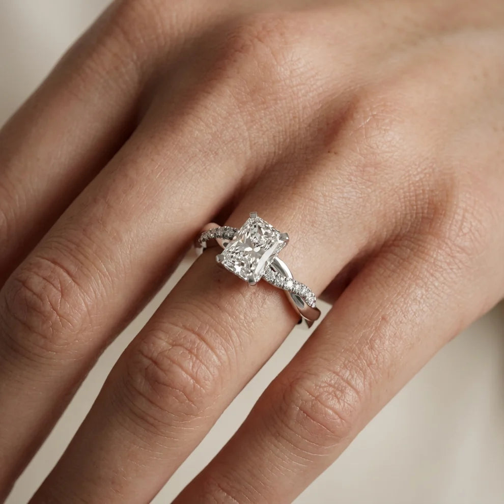 Twisted Side Stone Round Diamond Engagement Ring