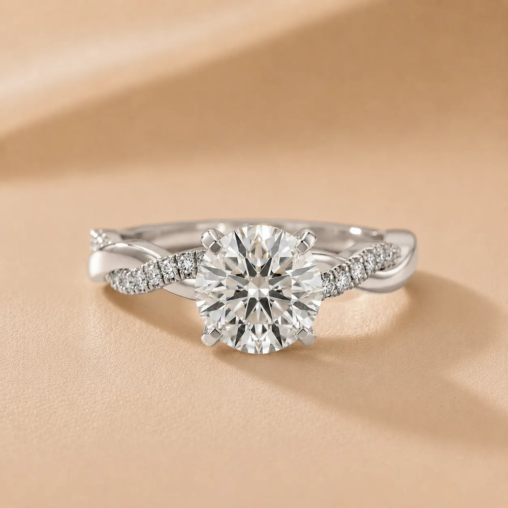 Twisted Side Stone Round Diamond Engagement Ring