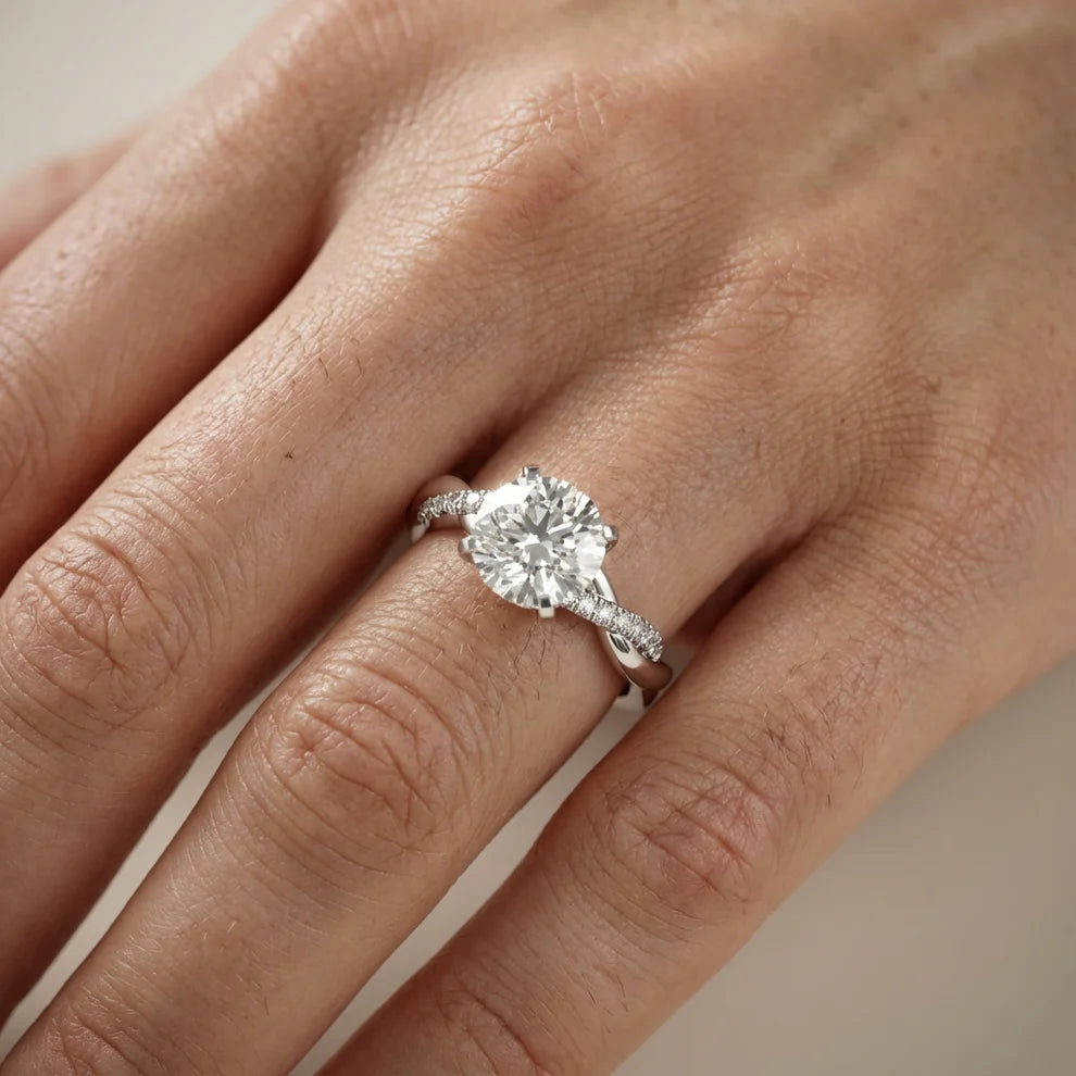Twisted Side Stone Round Diamond Engagement Ring