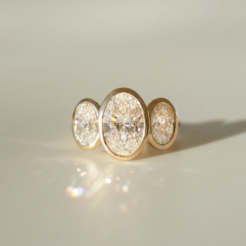 Bezel Set Three Stone Oval Cut Labgrown Engagement Ring